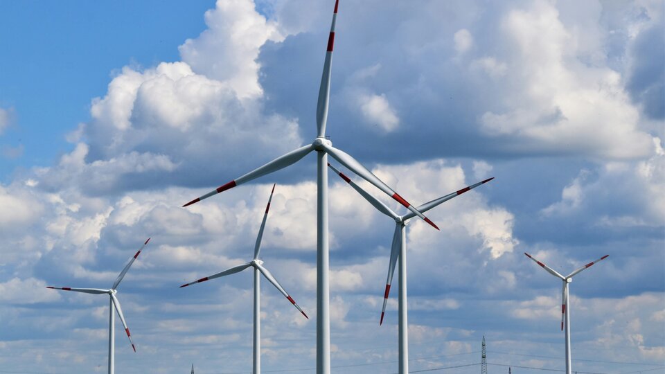 Wind turbines under a blue sky